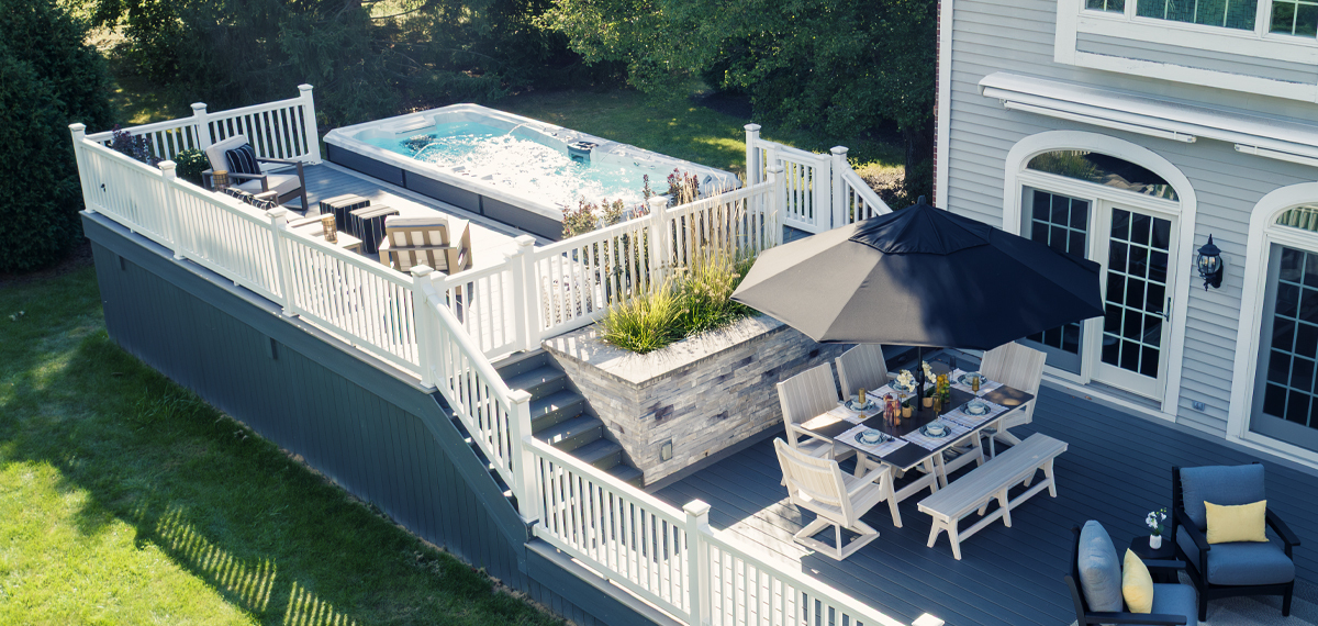 A swim spa surrounded by a deck.