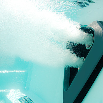 Swimmer inside a Trainer Series swim spa.